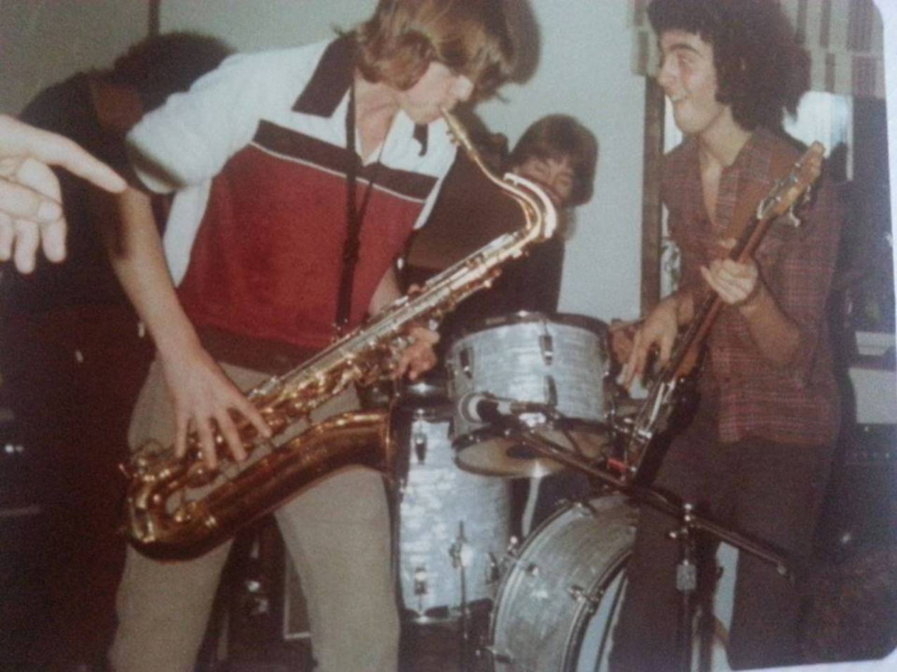 Young Paul O'Dell on bass in a room with saxophone and drums